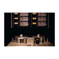 a reel to reel tape recorder in a dark room