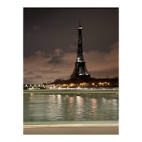 the eiffel tower at night in paris