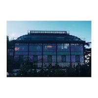 a building with a purple glass facade