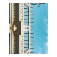 a photo of a bridge with a blue sky in the background